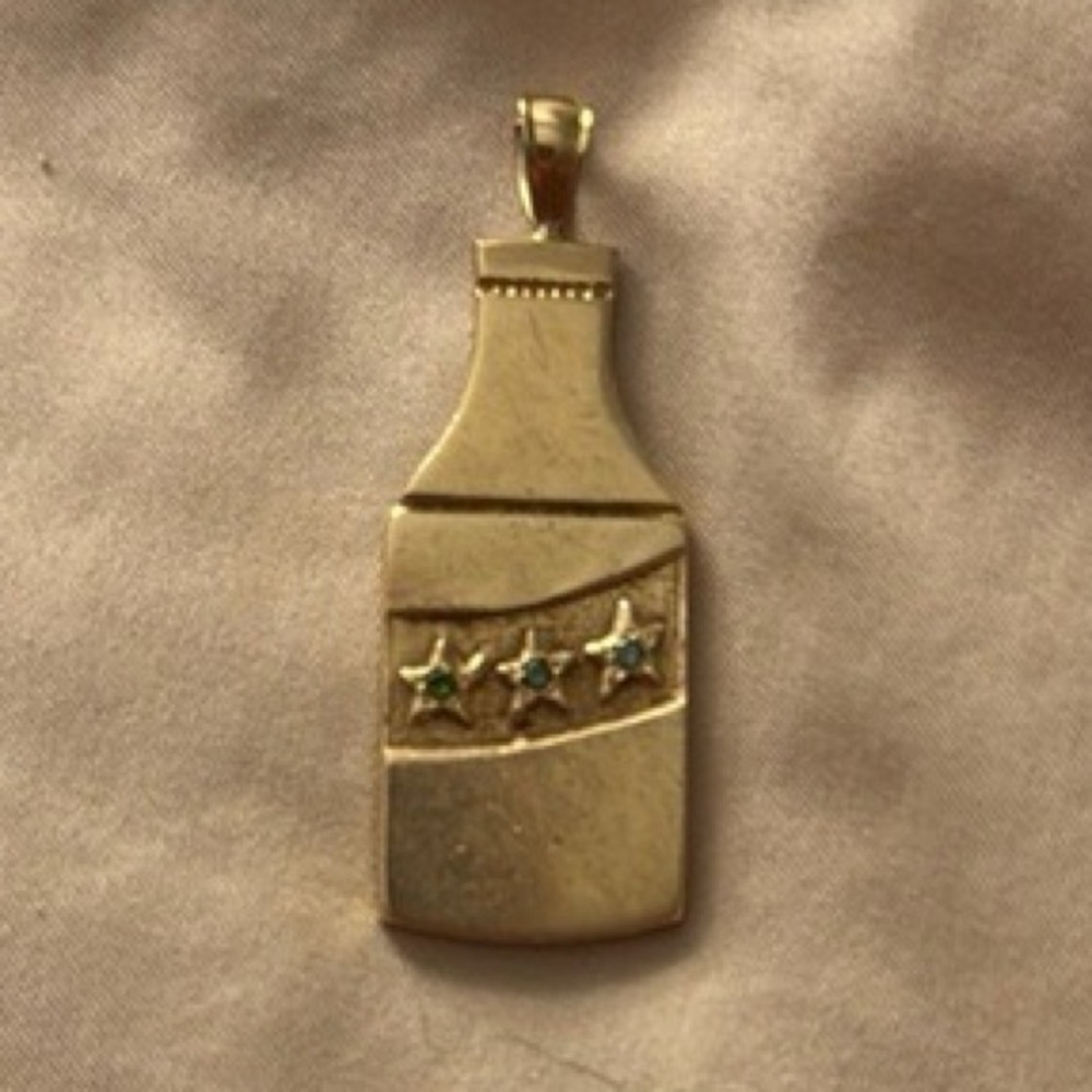 ISO 10k gold wine bottle with emeralds pendant or one similar